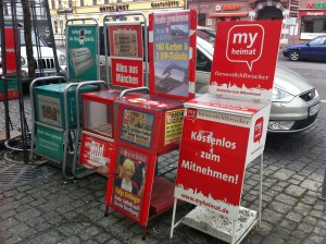 Neuer stummer Zeitungsverkäufer von MyHeimat.